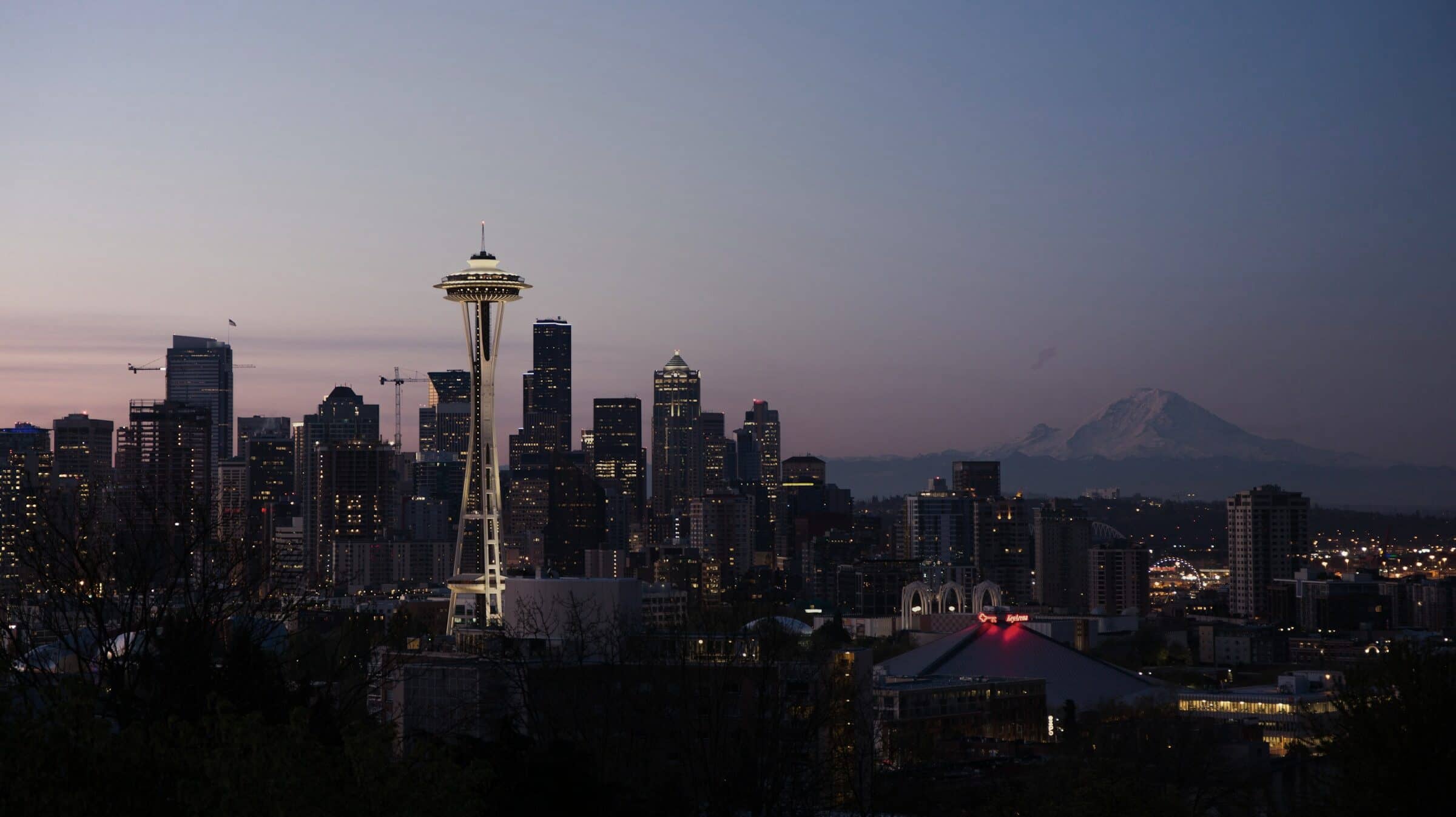 The Seattle skyline and Space Needle at dusk, Mount Rainier in the distance